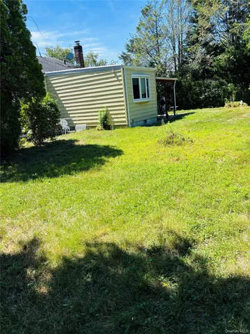 a view of a backyard with a small pool