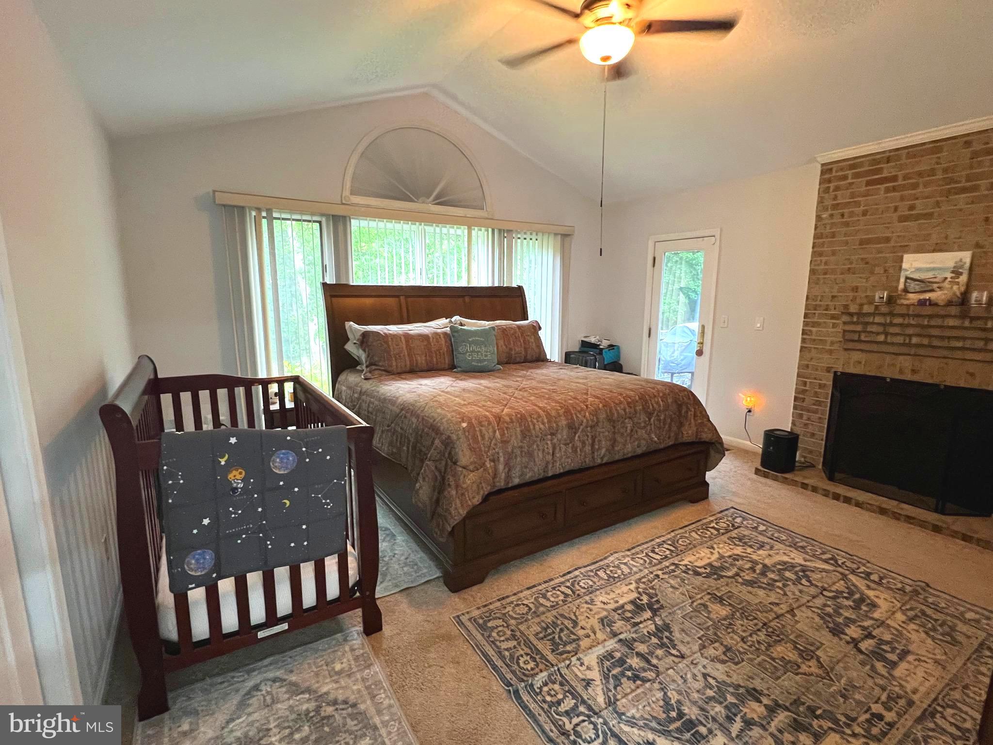 6450 Meadowlark Drive Dunkirk, MD 20754 - Photo 11 of 36 a bedroom with a bed and a fireplace