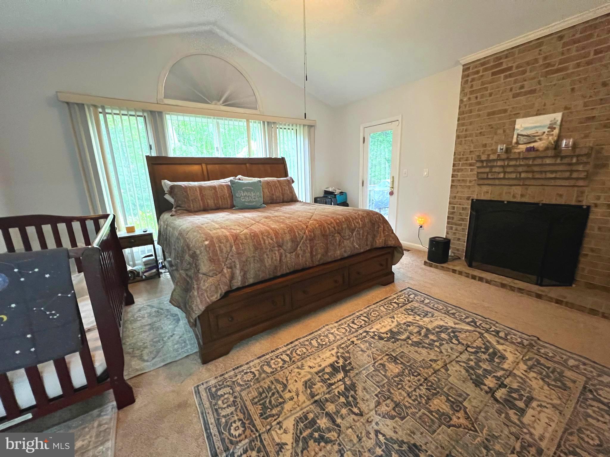 6450 Meadowlark Drive Dunkirk, MD 20754 - Photo 12 of 36 a bedroom with a bed and a fireplace