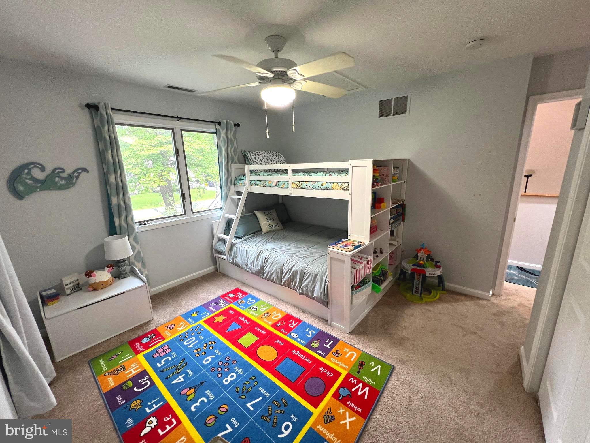 6450 Meadowlark Drive Dunkirk, MD 20754 - Photo 26 of 36 a living room with furniture and a baby crib