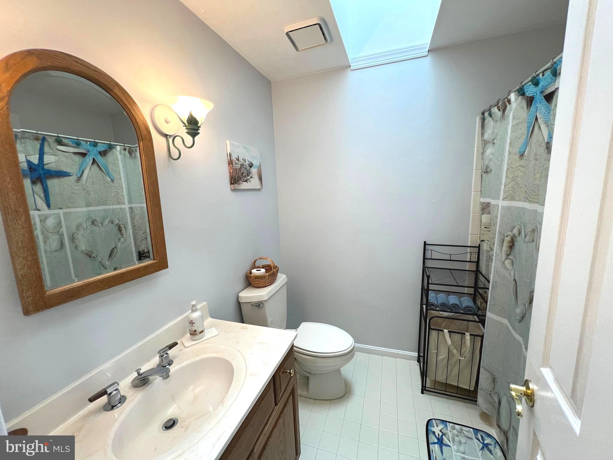 6450 Meadowlark Drive Dunkirk, MD 20754 - Photo 28 of 36 a bathroom with a sink toilet and vanity