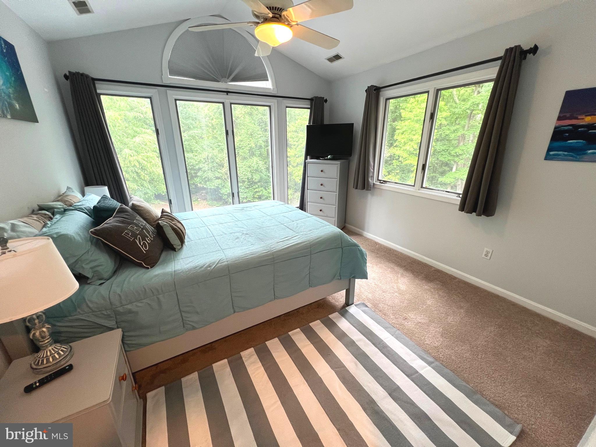 6450 Meadowlark Drive Dunkirk, MD 20754 - Photo 30 of 36 a bedroom with a bed and large windows