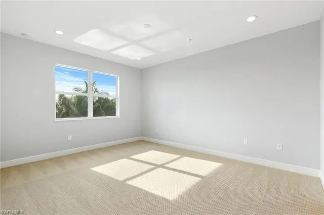 a spacious bathroom with a shower sink and mirror