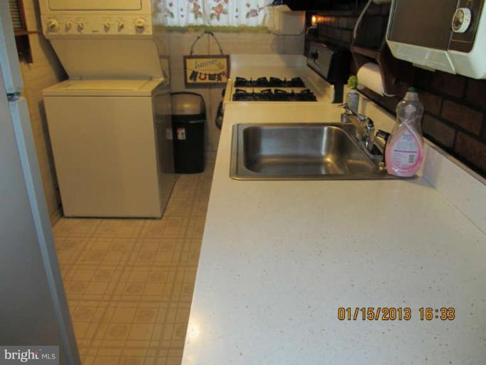 7617 Oxman Road Hyattsville, MD 20785 - Photo 7 of 9 a utility room with dryer and washer