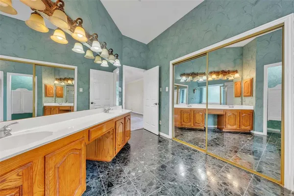 a large bathroom with a tub and shower