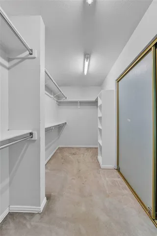 an empty room with a empty space and windows