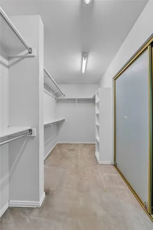 an empty room with a empty space and windows