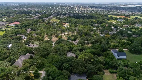 an aerial view of a city with lots of residential buildings