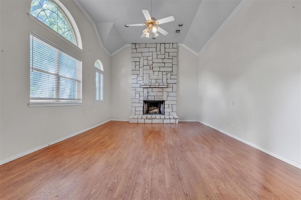 1409 Jackson Road Keller, TX 76262 - Photo 4 of 35 a view of an empty room with a window and fireplace