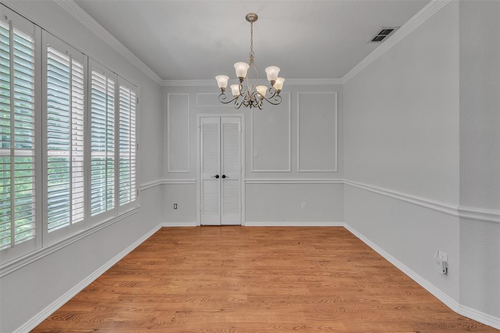 1409 Jackson Road Keller, TX 76262 - Photo 6 of 35 a view of a room with a chandelier fan and windows