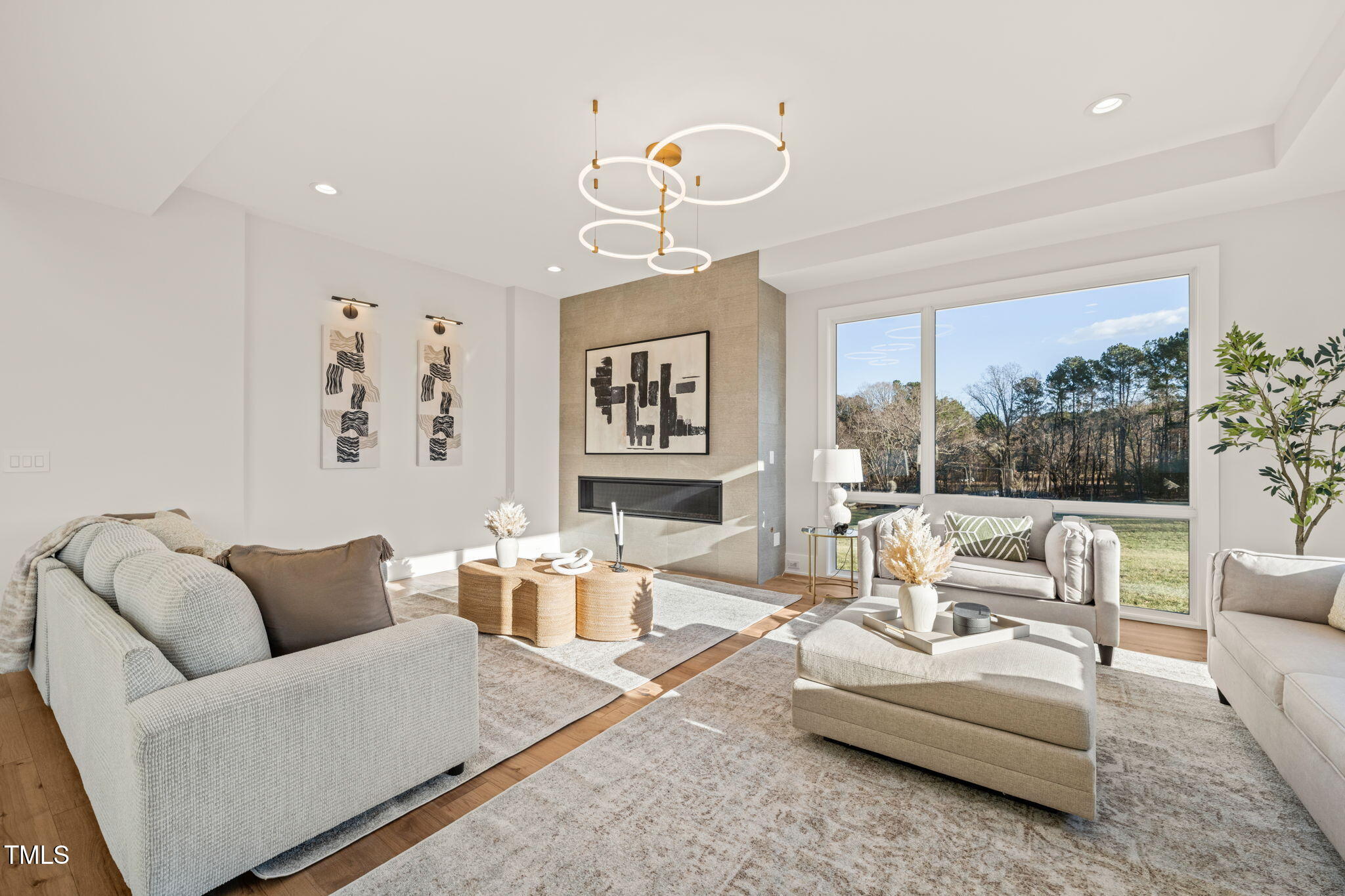 9009 Meadow Pointe Court Wake Forest, NC 27587 - Photo 14 of 76 a living room with furniture potted plant and a large window