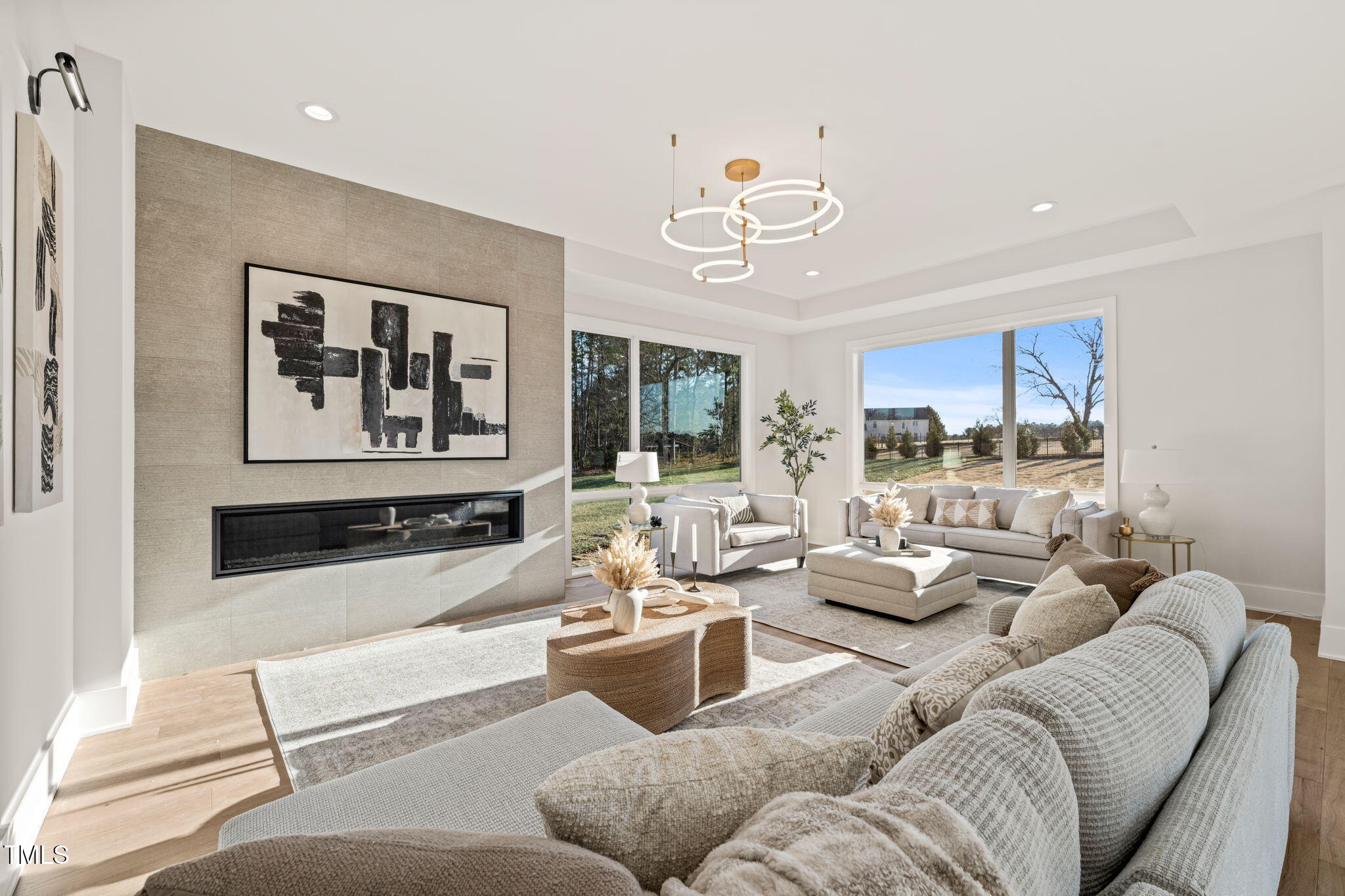 9009 Meadow Pointe Court Wake Forest, NC 27587 - Photo 15 of 76 a living room with furniture and a large window