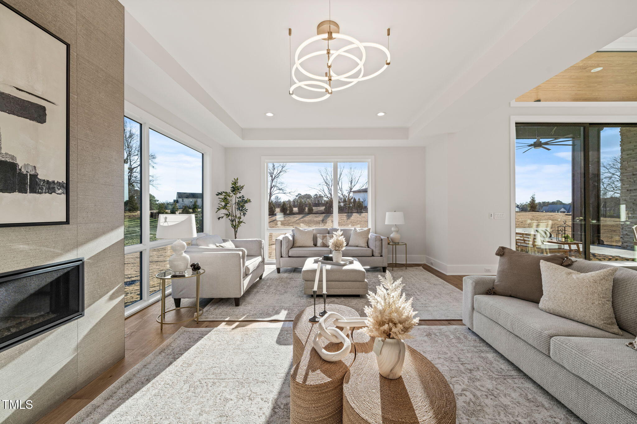 9009 Meadow Pointe Court Wake Forest, NC 27587 - Photo 18 of 76 a living room with furniture large window and outdoor view