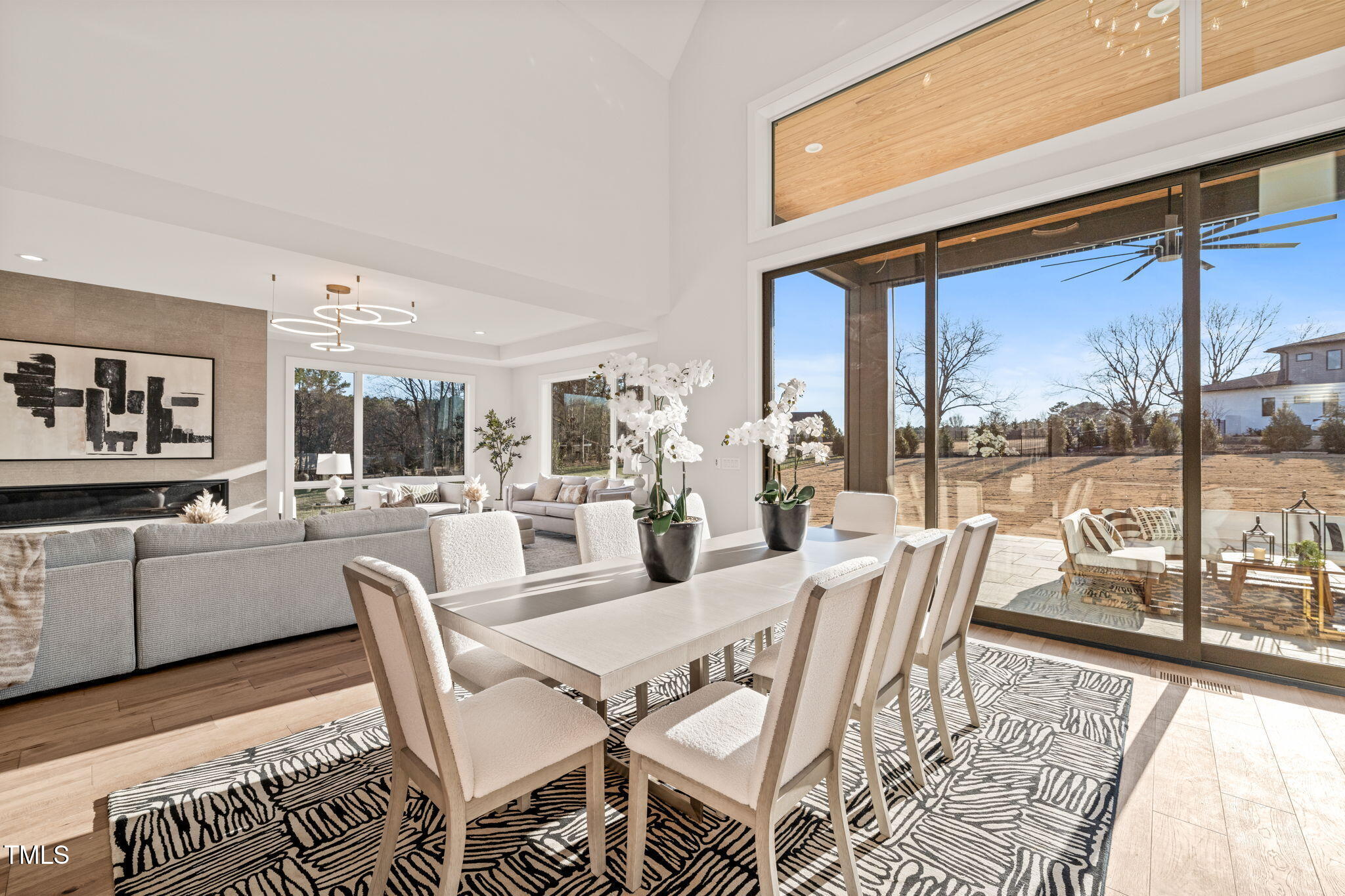 9009 Meadow Pointe Court Wake Forest, NC 27587 - Photo 20 of 76 a dining room with furniture and a floor to ceiling window