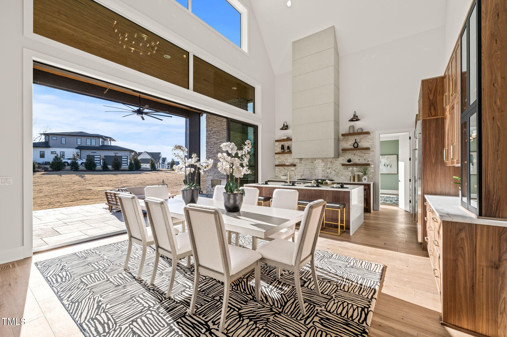 9009 Meadow Pointe Court Wake Forest, NC 27587 - Photo 24 of 76 a dining room with furniture and a floor to ceiling window