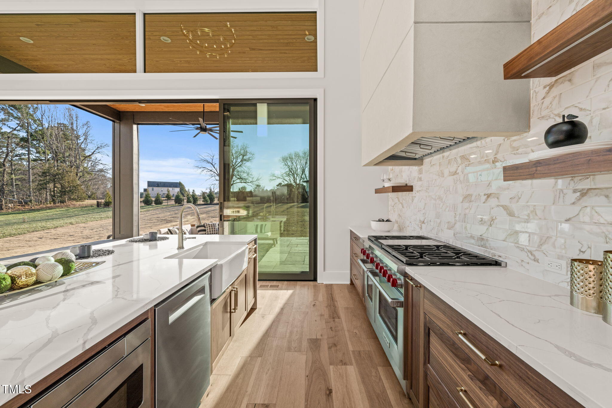 9009 Meadow Pointe Court Wake Forest, NC 27587 - Photo 25 of 76 a kitchen with a stove a sink and a refrigerator