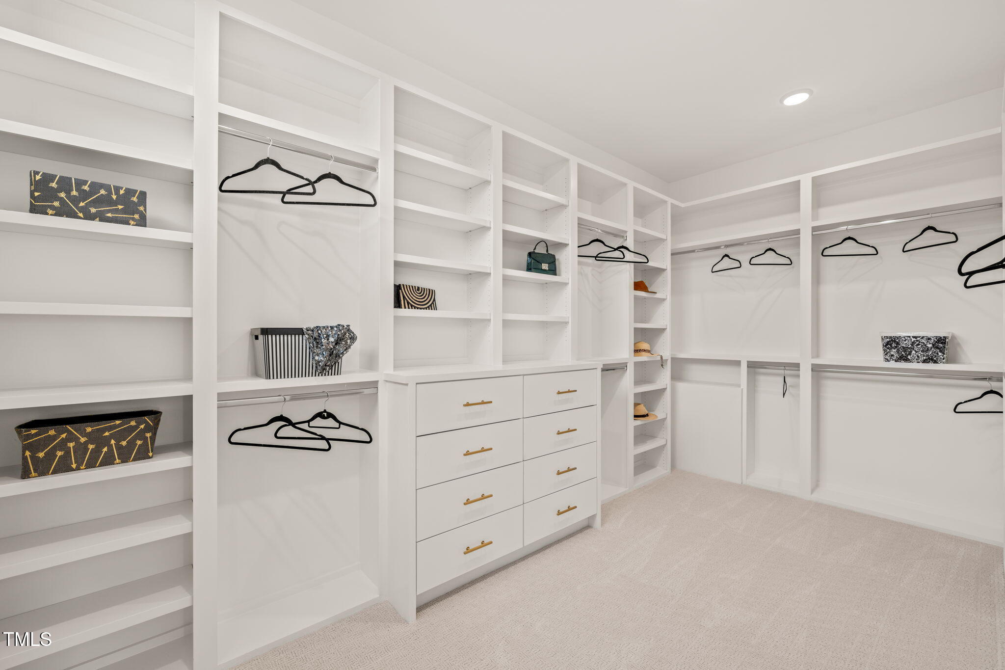 9009 Meadow Pointe Court Wake Forest, NC 27587 - Photo 40 of 76 a view of walk in closet with clothes and shoes