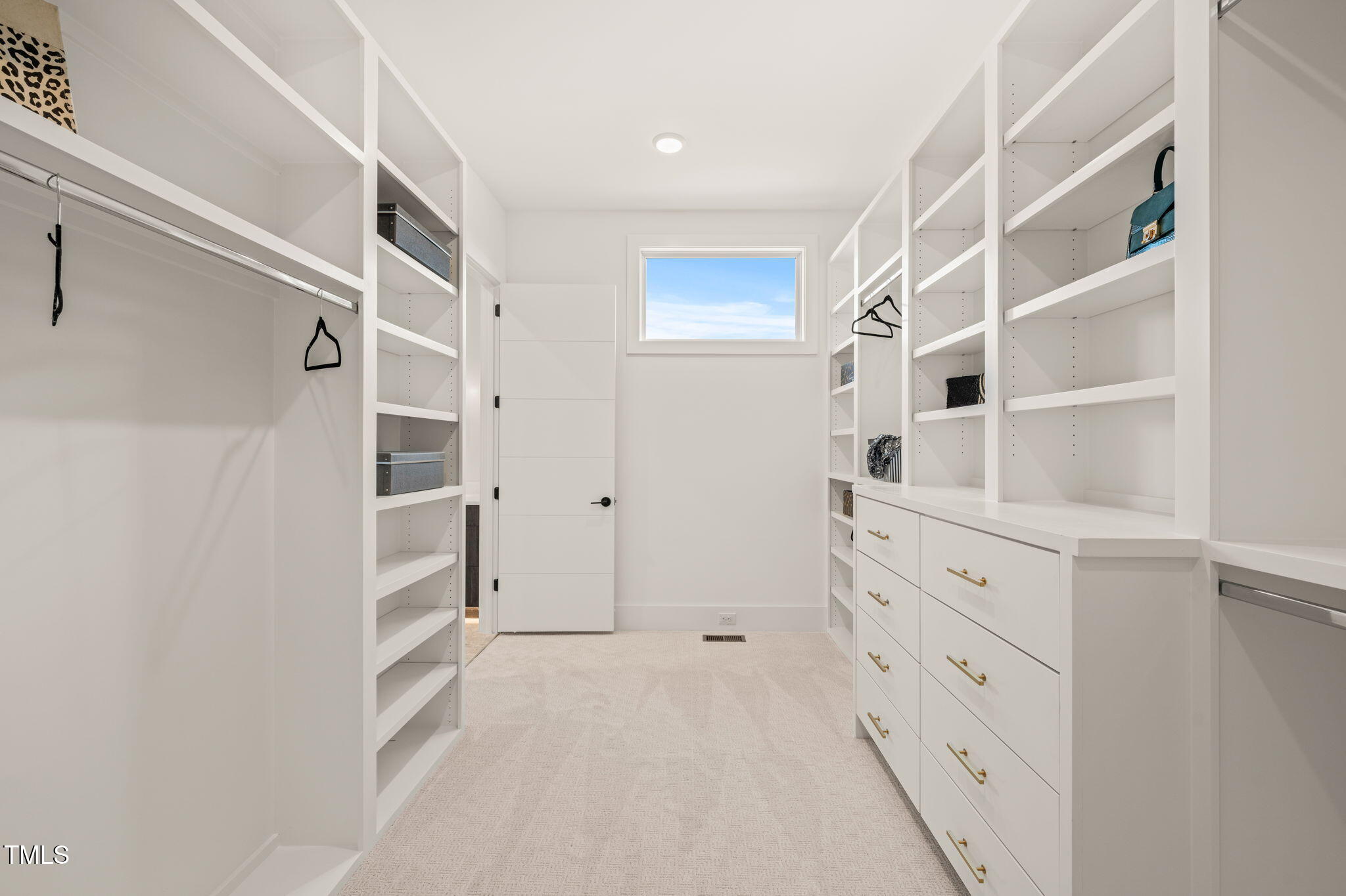 9009 Meadow Pointe Court Wake Forest, NC 27587 - Photo 41 of 76 a view of walk in closet with empty racks