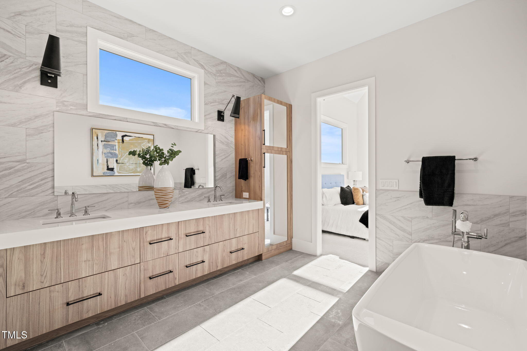 9009 Meadow Pointe Court Wake Forest, NC 27587 - Photo 48 of 76 a spacious bathroom with a double vanity sink a mirror and shower