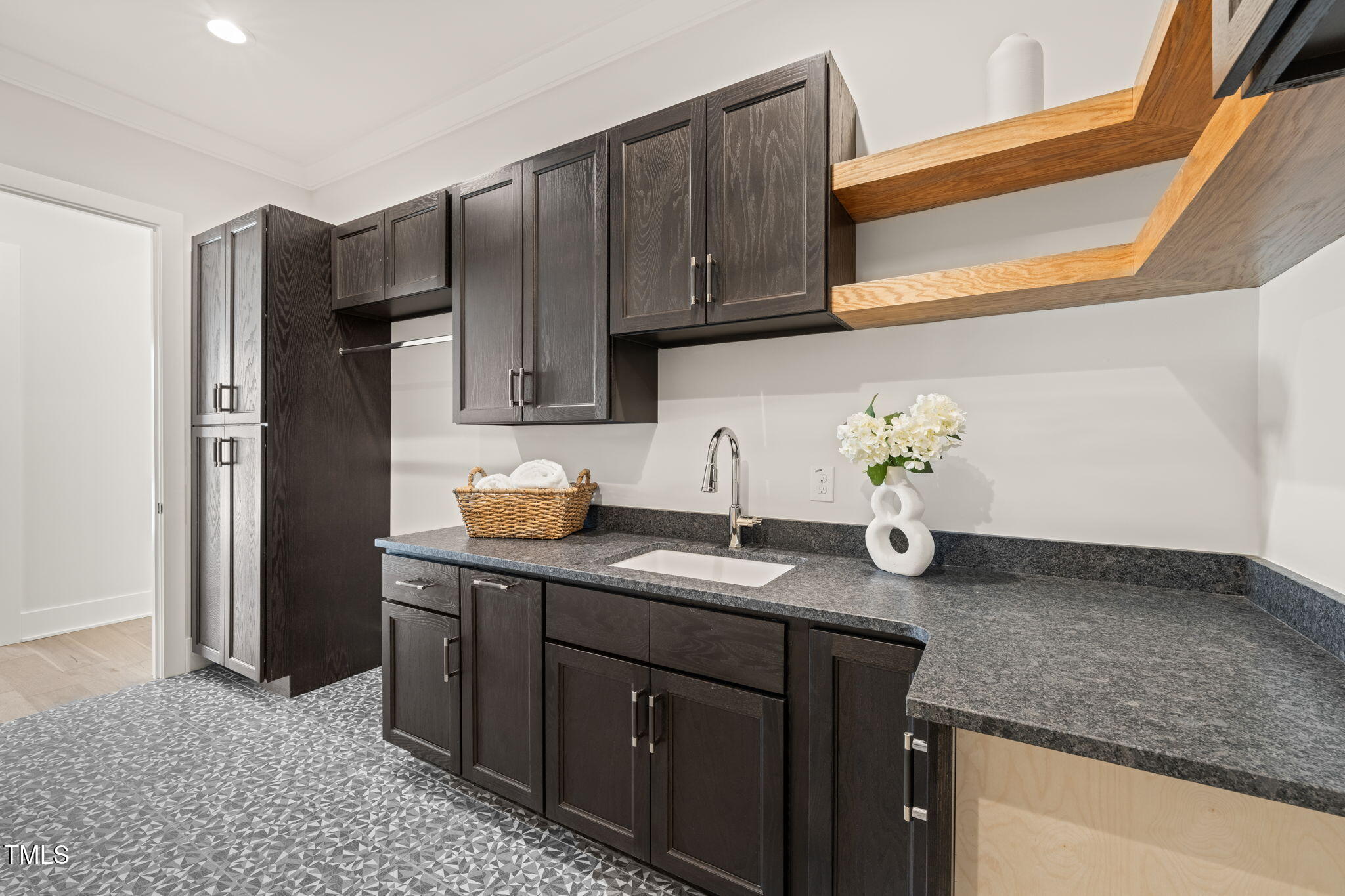 9009 Meadow Pointe Court Wake Forest, NC 27587 - Photo 60 of 76 a kitchen with granite countertop stainless steel appliances a sink a refrigerator and cabinets