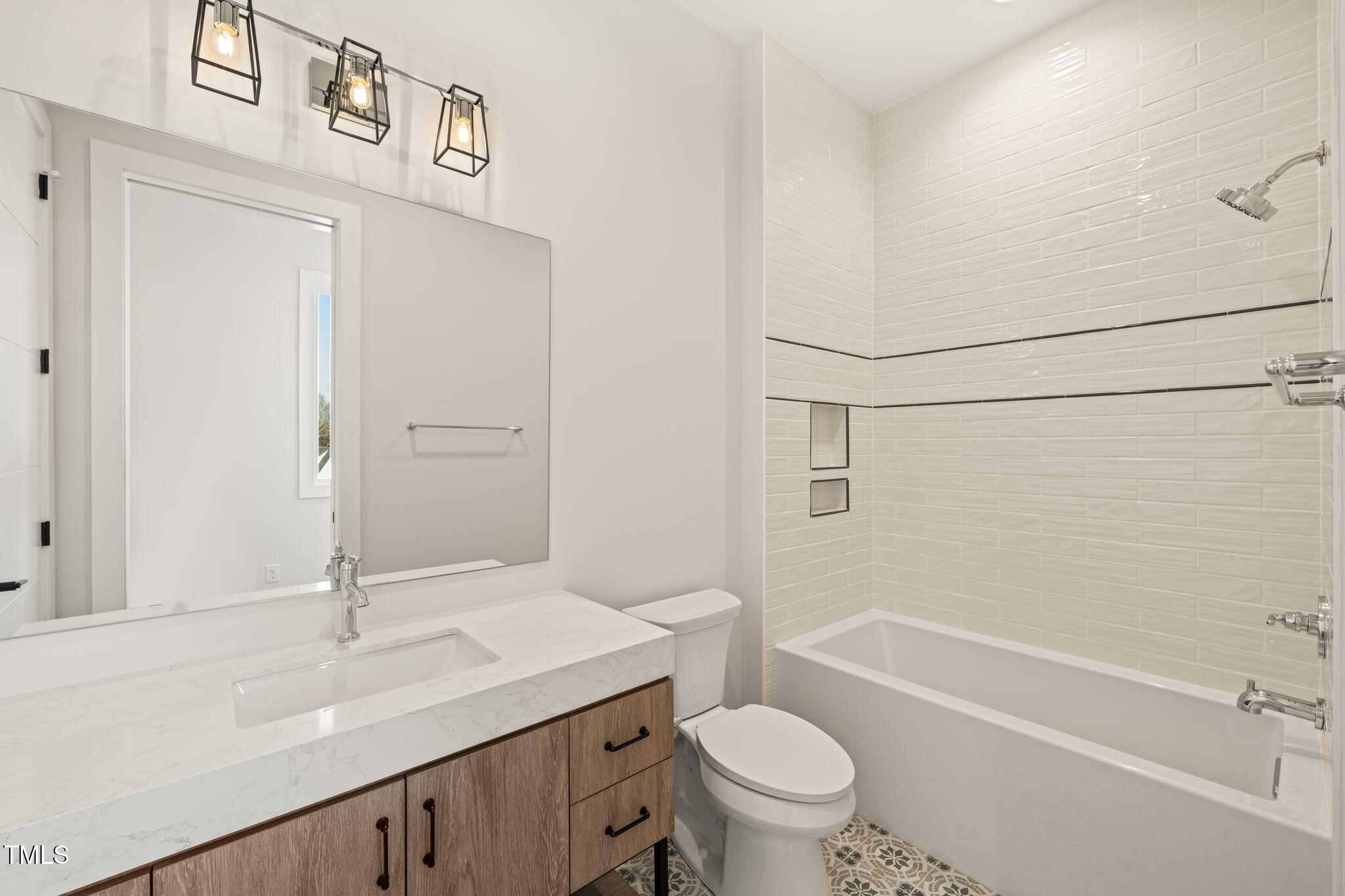 9009 Meadow Pointe Court Wake Forest, NC 27587 - Photo 63 of 76 a bathroom with a sink a toilet and shower