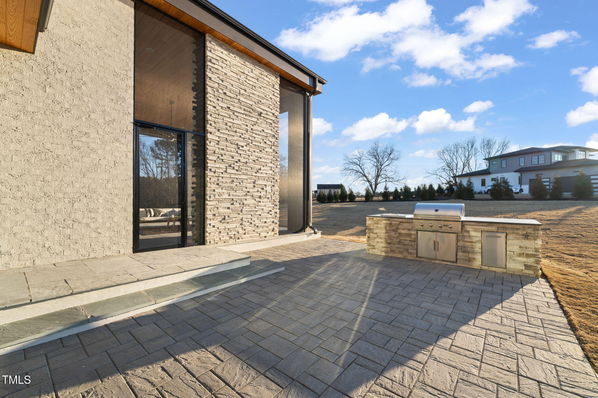 9009 Meadow Pointe Court Wake Forest, NC 27587 - Photo 74 of 76 a view of a patio with dining table and chairs with wooden floor