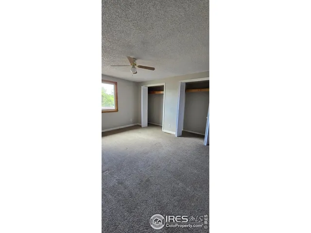 a view of a room with a large window