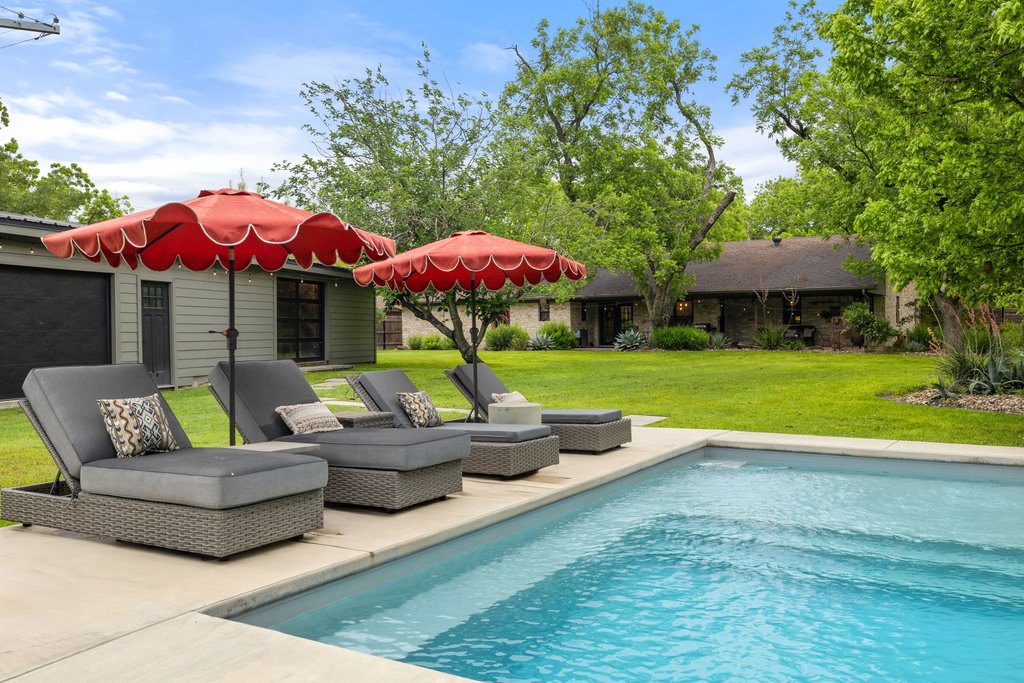 302 South Schramm Road Granger, TX 76530 - Photo 2 of 33 a view of pool with outdoor seating