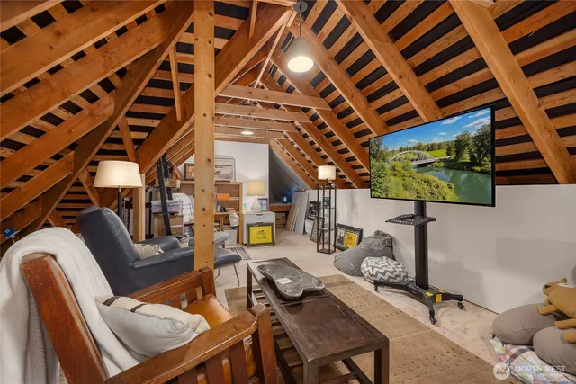 a view of a livingroom with furniture and a rug