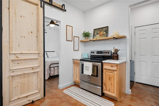 a kitchen with stainless steel appliances a refrigerator and cabinets