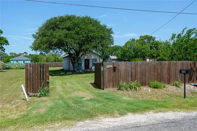 a garden with wooden fence
