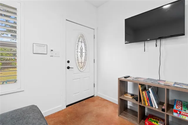 a livingroom with an empty room and a flat screen tv