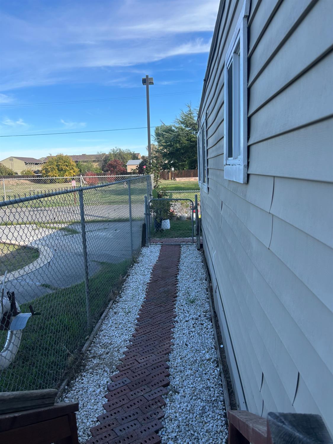 1781 Franklin Road, Unit 59 Yuba City, CA 95993 - Photo 16 of 17 a view of a pathway with a wooden fence