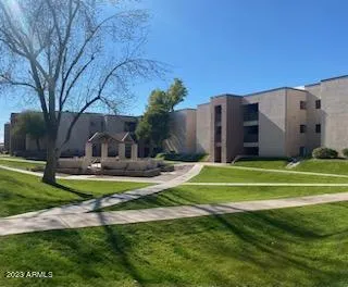 a view of a fountain in front of a house