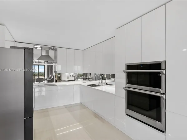 a kitchen with granite countertop a stove and a microwave