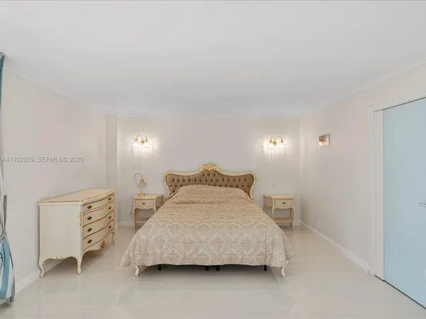a bedroom with a bed and a cabinets