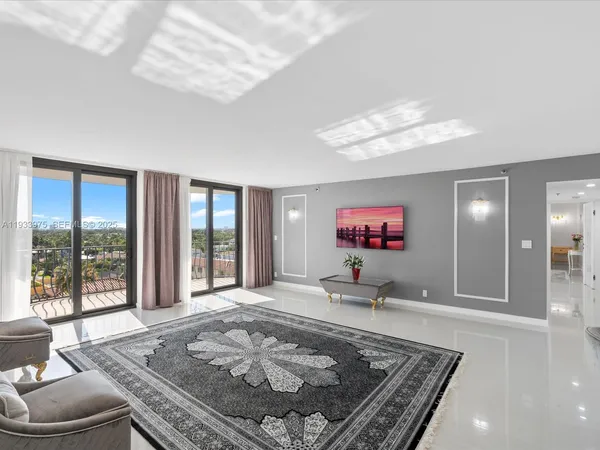 a living room with furniture and a rug