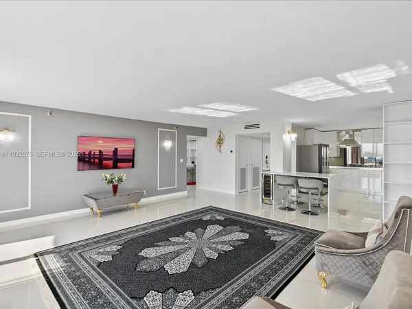 a living room with furniture and a rug