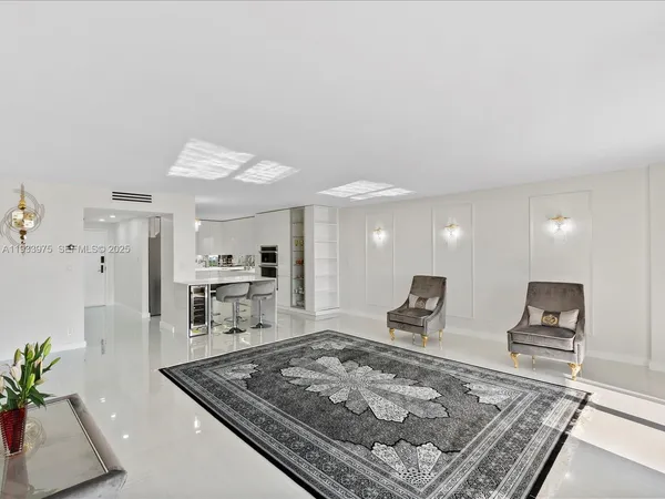 a large kitchen with stainless steel appliances granite countertop a sink stove and refrigerator