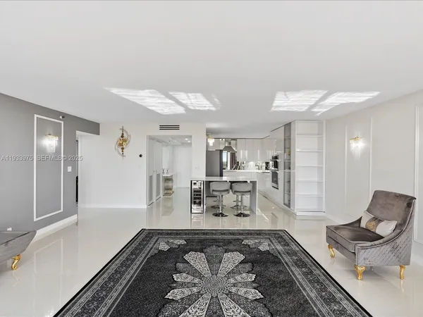 a living room with furniture and a rug