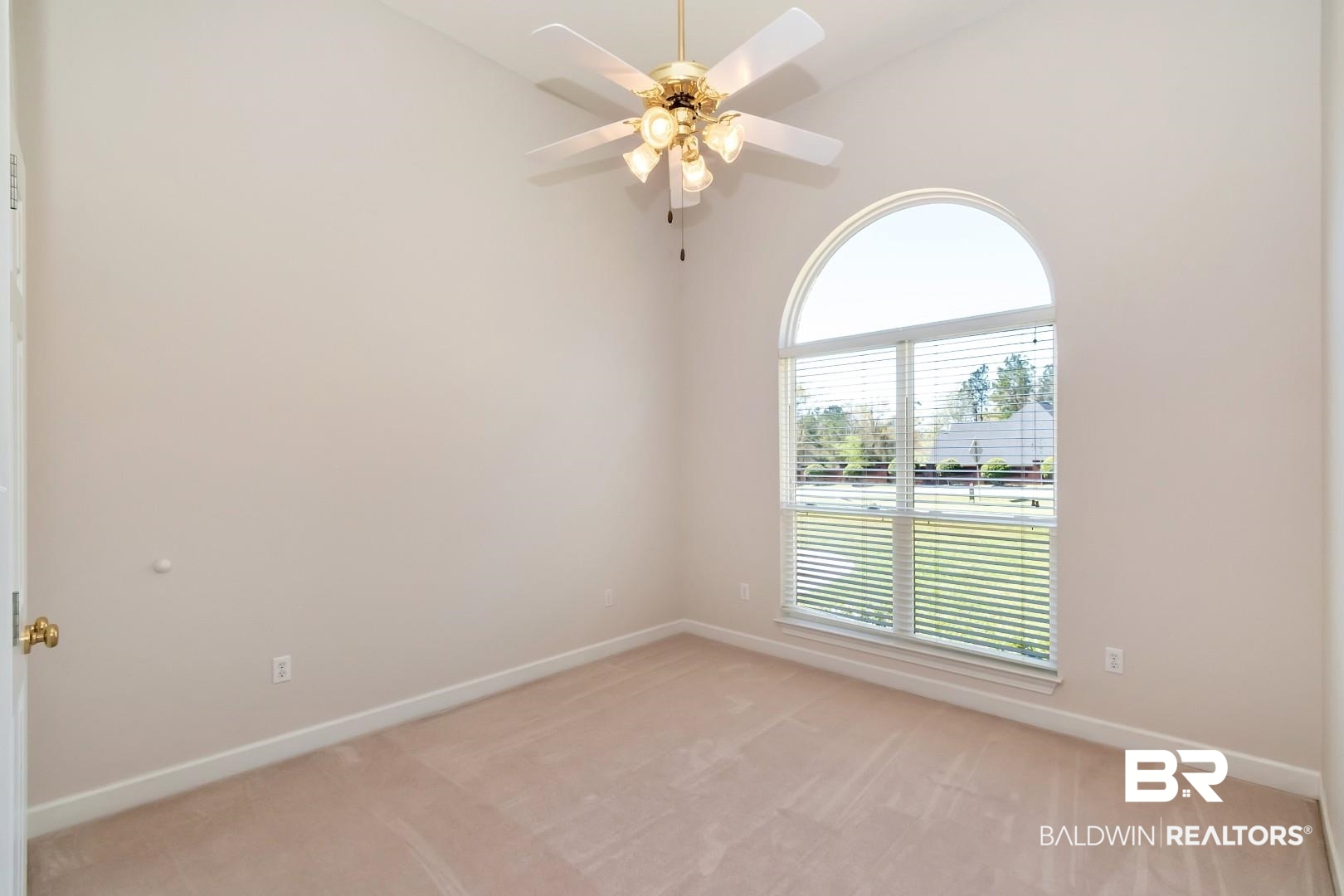 6090 Celeste Road Saraland, AL 36571 - Photo 25 of 38 Spare room featuring light carpet, baseboards, and a ceiling fan