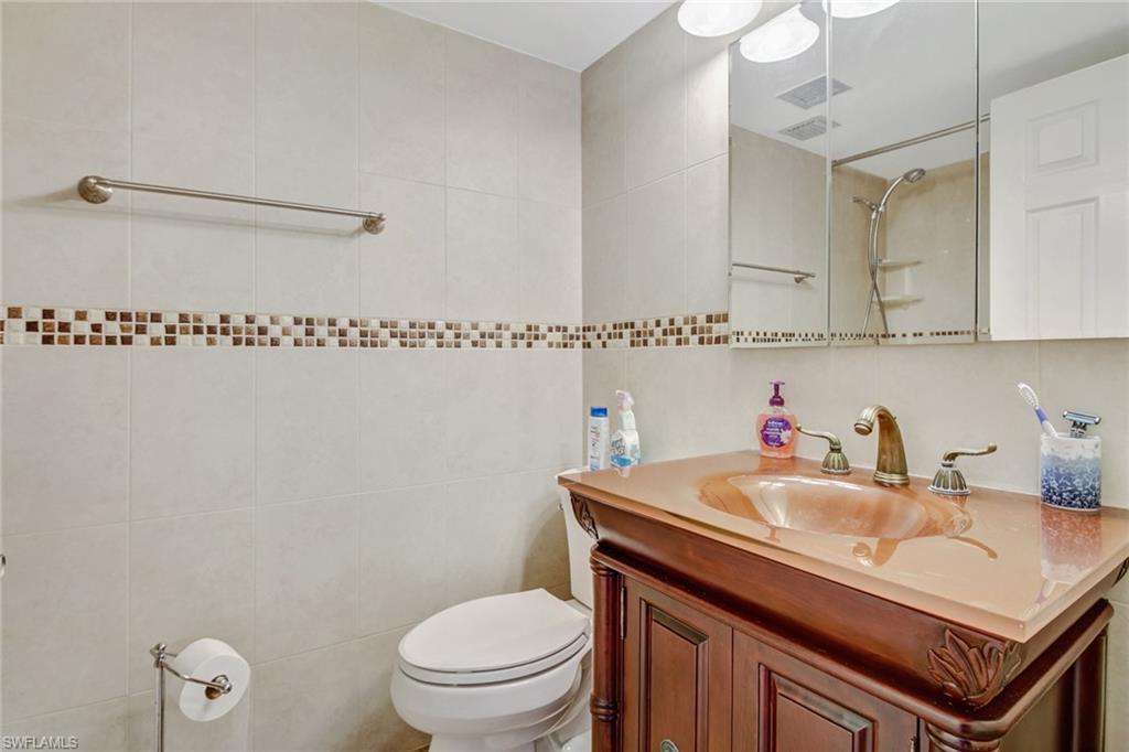 49 High Point Circle South, Unit 102 Naples, FL 34103 - Photo 18 of 42 Guest bathroom