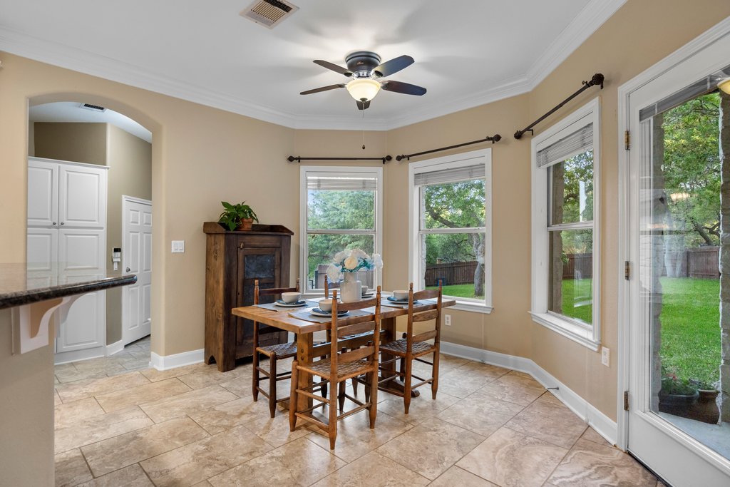 211 River Down Road Georgetown, TX 78628 - Photo 12 of 39 Large windows bring in natural light and create a bright dining atmosphere in the breakfast room.