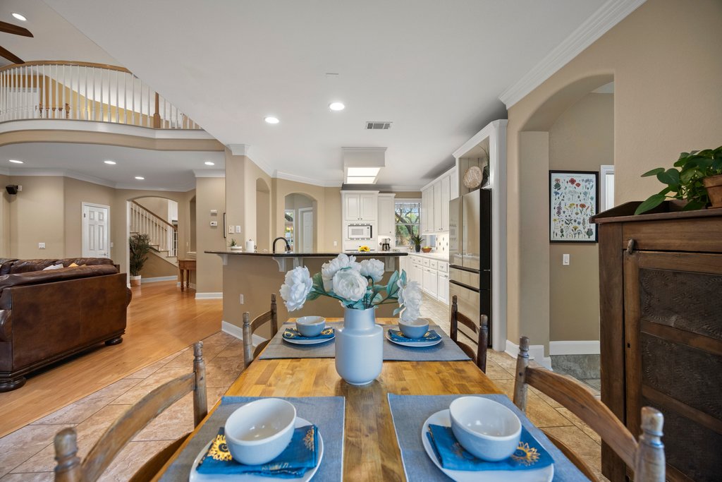 211 River Down Road Georgetown, TX 78628 - Photo 13 of 39 The eat-in kitchen’s open design connects seamlessly with the surrounding living spaces.