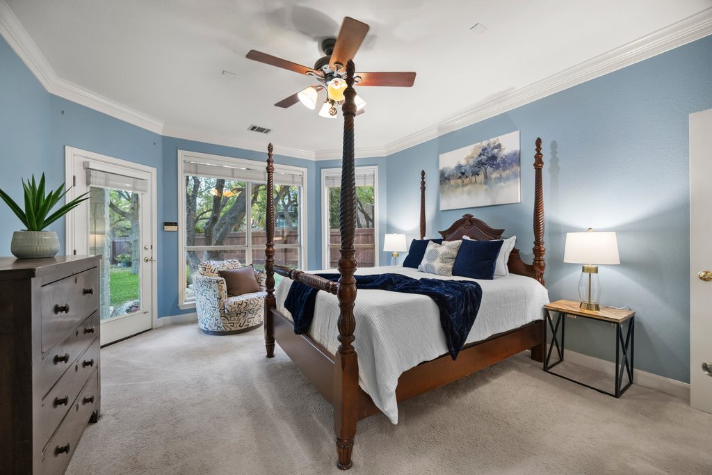 211 River Down Road Georgetown, TX 78628 - Photo 14 of 39 The spacious primary bedroom offers a peaceful retreat with plenty of room for a full bedroom suite.