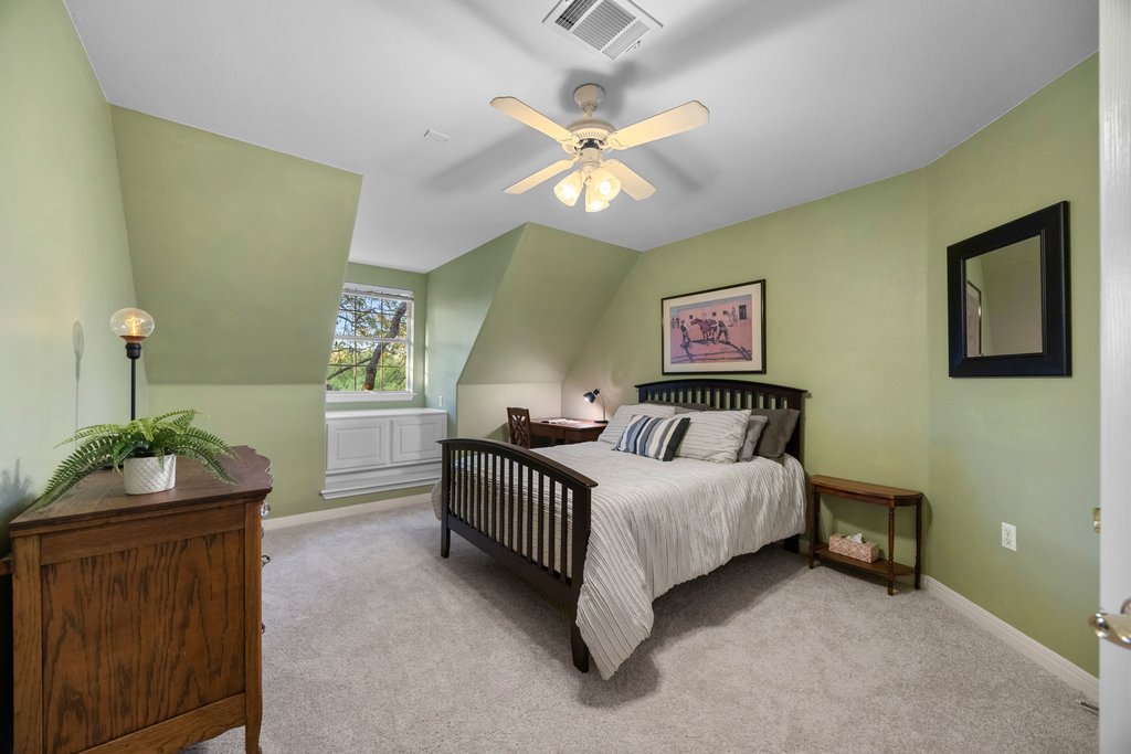 211 River Down Road Georgetown, TX 78628 - Photo 21 of 39 The secondary bedrooms offer comfortable accommodations for family members or guests.