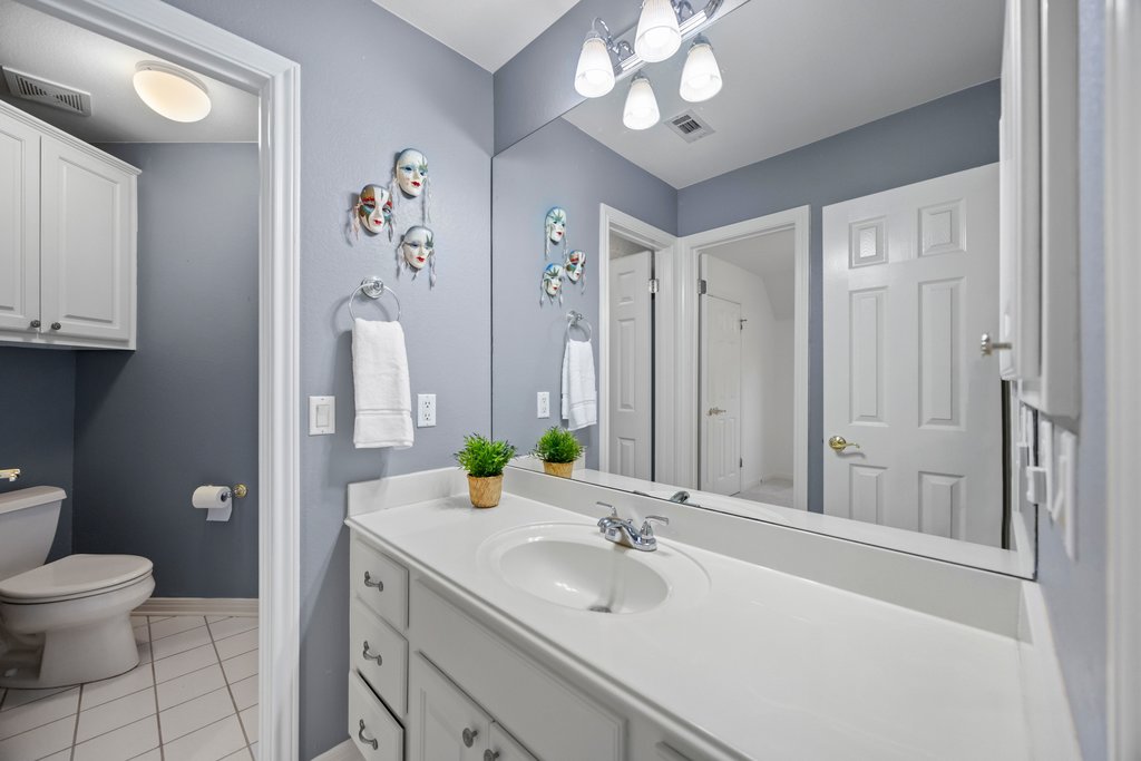 211 River Down Road Georgetown, TX 78628 - Photo 25 of 39 The guest bathroom features a clean, functional layout designed for both family and visitors.