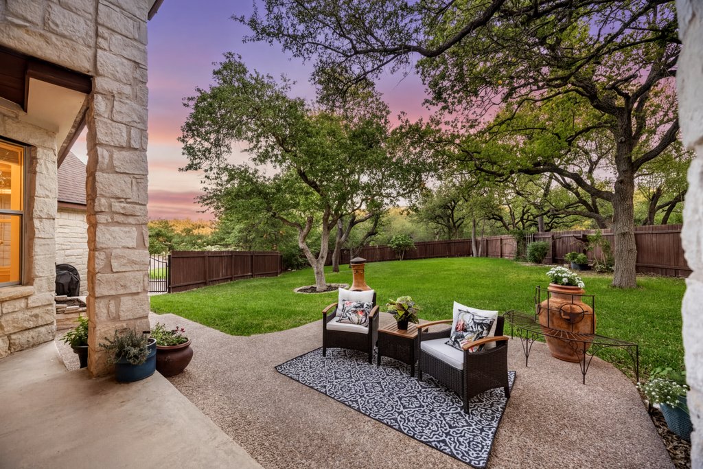 211 River Down Road Georgetown, TX 78628 - Photo 27 of 39 The covered patio offers a comfortable space to relax while enjoying views of the backyard and greenbelt.