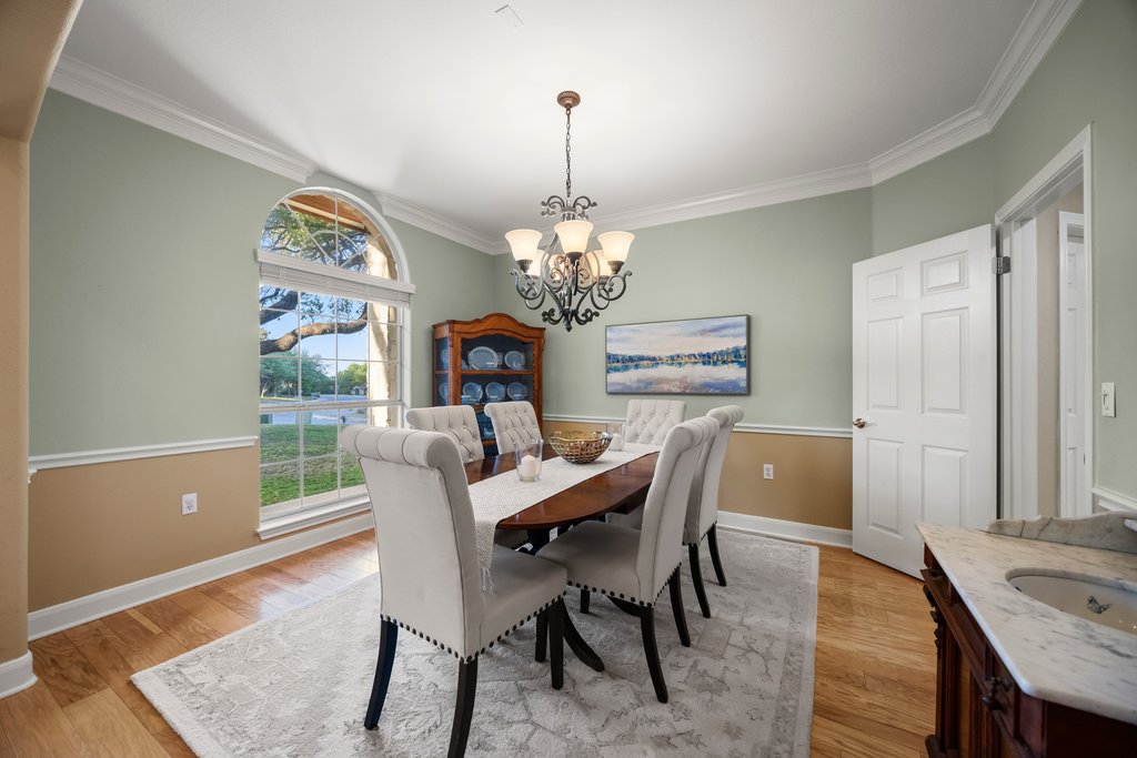 211 River Down Road Georgetown, TX 78628 - Photo 5 of 39 The formal dining room offers a dedicated space for gatherings, celebrations, and holiday meals.
