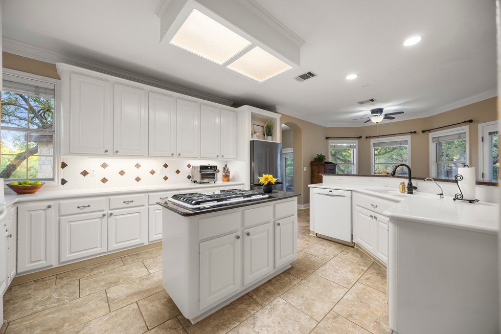 211 River Down Road Georgetown, TX 78628 - Photo 9 of 39 The kitchen offers generous cabinetry and ample counter space for everyday cooking and entertaining.